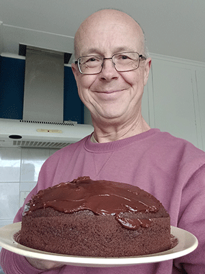 Photo of Peter Weatherall with cake