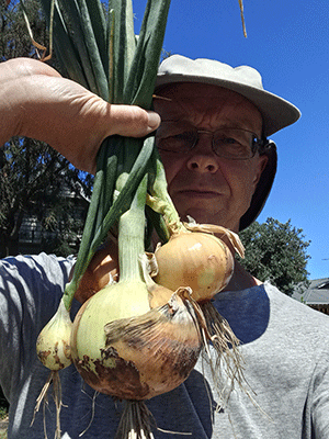 Photo of Peter Weatherall with onions